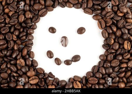 Smileys in coffee beans, a cheerful message from coffee beans. Stock Photo