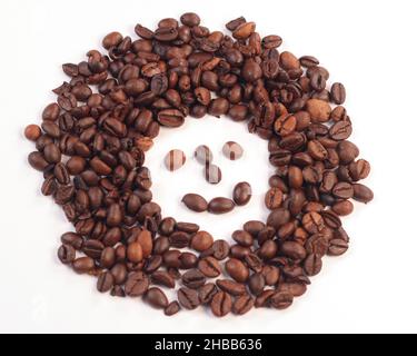 Smileys in coffee beans, a cheerful message from coffee beans. Stock Photo
