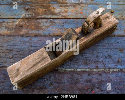 Old Wooden Block Plane on Workbench Stock Photo