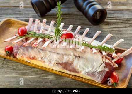 raw lamb chops on wooden background. Lamb chops with spices and close-up. Horizontal view Stock Photo