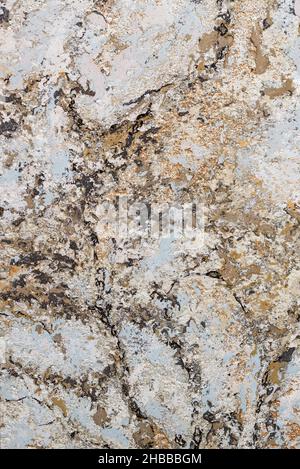 Background of beige, brown, blue, gold abstract color pattern in avant-garde style with black veins and splashes. Vertical image. Stock Photo