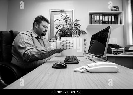 JOHANNESBURG, SOUTH AFRICA - Aug 09, 2021: An angry man frustrated with a desktop computer Stock Photo