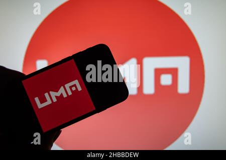 Rheinbach, Germany  20 December 2021,  The logo of the cryptocurrency 'UMA' on the display of a smartphone (focus on the logo) Stock Photo