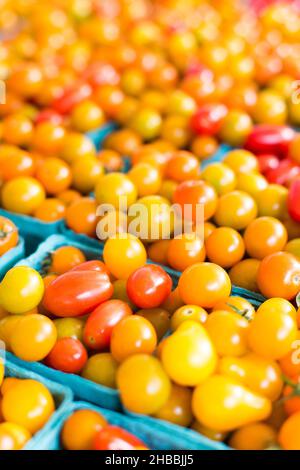 Fresh tomatoes in a farmer's market. Stock Photo