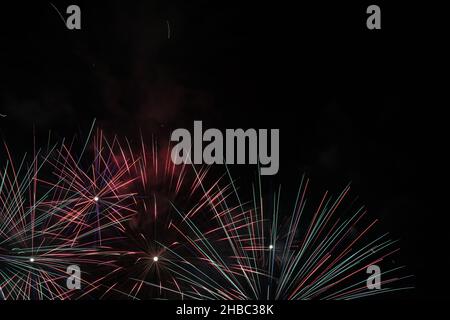 Stunning colorful fireworks and black night sky photographed in Dubai, UAE during Dubai shopping festival. Lovely celebration photo for New Year's Eve Stock Photo