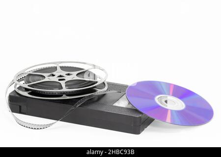 Reel tape, VHS tape and disk. Evolution of technology. Studio shot on a white background Stock Photo