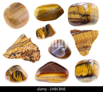 set of various tigers eye gemstones cutout on white background Stock Photo