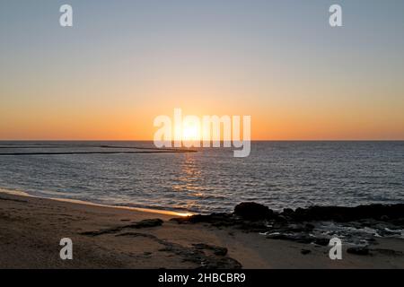 Sunset on a beach in Chipiona, Cadiz, Andalusia, Spain Stock Photo
