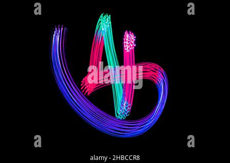 Light Neon Trails Colorful Wave Isolated on black background. Futuristic Colorful Overlay Light Pattern. Stock Photo