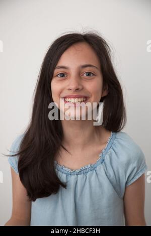A portrait of a ten year old girl of mixed race including Caucasian, Asian and Black Stock Photo