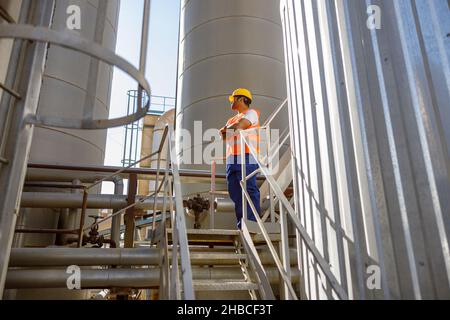 Experienced worker concentrating at his work in plant Stock Photo