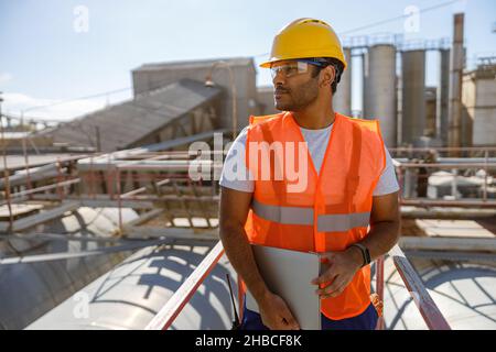 Experienced worker concentrating at his work in plant Stock Photo