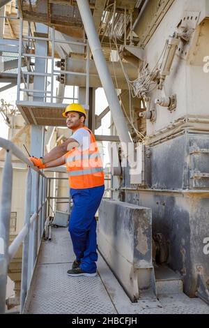 Experienced worker concentrating at his work in plant Stock Photo