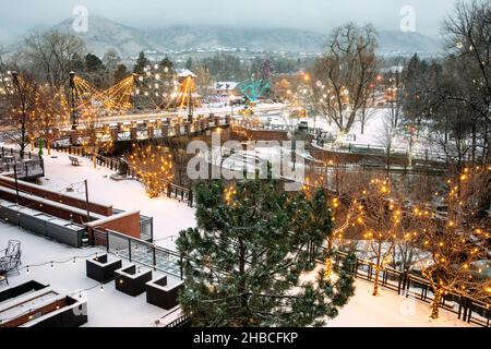 Christmas lights in winter, Golden, Colorado, USA. [Washington Avenue Bridge over Clear Creek.] Stock Photo