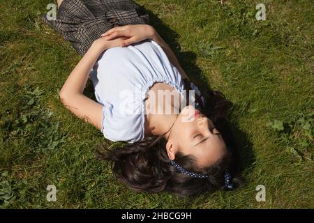 A girl relaxing in her garden Stock Photo