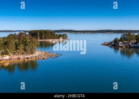 Small islets (skerry), overgrown with trees, in the Baltic Sea in Finland Stock Photo