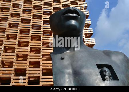 Milan, Italy - October 20, 2015: Romantic artistic bronze sculpture in front of the wooden crate wall of the Polish pavilion EXPO Milan 2015. Close-up Stock Photo