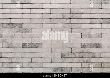 Facing decorative tiles stylized as bricks. Construction material Stock Photo