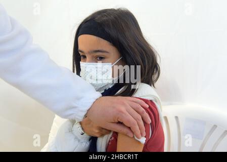Calafell, Tarragona, Spain. 30th Sep, 2021. A girl seen after receiving a dose of the Pfizer-BioNTech vaccine at a vaccination centre.The Department of Health of Catalonia through the Xarxa Santa Tecla de Tarragona in the prevention of the contagion of SARS-CoV-2 Covid-19 and the new contagion strain Ã³micron has administered the first dose of the COMIRNATY vaccine (COVID-19 vaccine mRNA, Pfizer-BioNTech) to boys and girls between 5 and 11 years of age at the vaccination center located at the Joan Ortoll Sports Pavilion in Calafell. (Credit Image: © Ramon Costa/SOPA Images via ZUMA Press Stock Photo