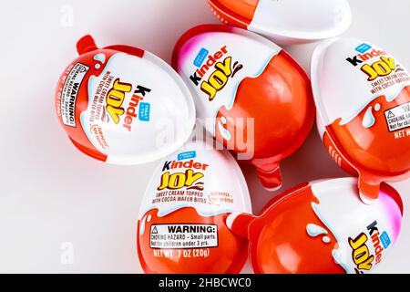 May 4, 2021. New York. Kinder joy milk chocolate eggs on white background. Stock Photo