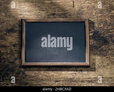 blackboard frame on wooden table background, top view Stock Photo