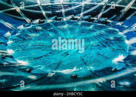 Whirl pool created in a huge funnel, Marina Bay Sands, Singapore. Stock Photo