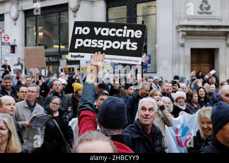 London, UK, 18th Dec, 2021. Anti-vaccine passport protesters march in central London against the implementation of such health measures, viewing them as discriminatory and removing bodily autonomy. In the light of rising cases of the Omicron variant it is looking increasingly likely other measures will be introduced, including a 'circuit-breaker' lockdown and no indoor mixing, which the group are strongly opposed to. Credit: Eleventh Hour Photography/Alamy Live News