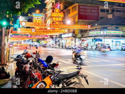 Motorcycle motorbike in motion blur riding on Yaowarat Rd, Chinatown, Bangkok, Thailand Stock Photo