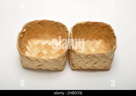 Traditional containers made of bamboo white background studio shoot Stock Photo