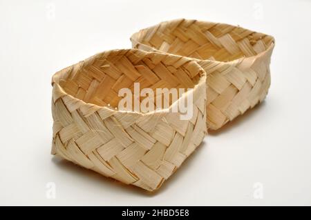 Traditional containers made of bamboo white background studio shoot Stock Photo