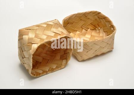 Traditional containers made of bamboo white background studio shoot Stock Photo