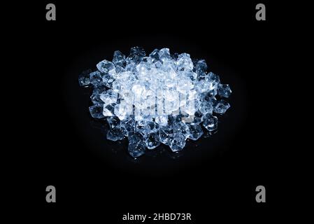 Ice crystal cubes on a black background, space for text or design. Stock Photo