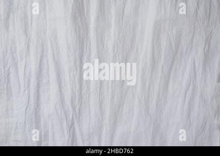 Crumpled white paper background. Top view. Copy space. Stock Photo