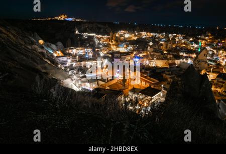 Views of Gereme tourist town and Uchisar castle at night in Cappadocia. Night scene with stary night. Romantic tourist attraction in Turkey. Stock Photo