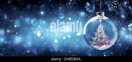 Christmas Tree In Bauble Hanging Fir Branch With Gift Boxes In Blue Abstract Night Stock Photo