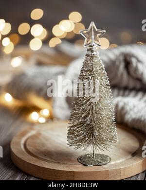 Decorative Christmas tree on blurred background with bokeh. Stock Photo