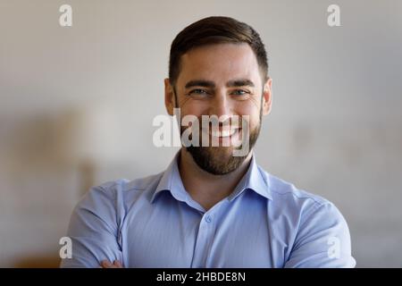 Head shot portrait of smiling confident young man. Stock Photo