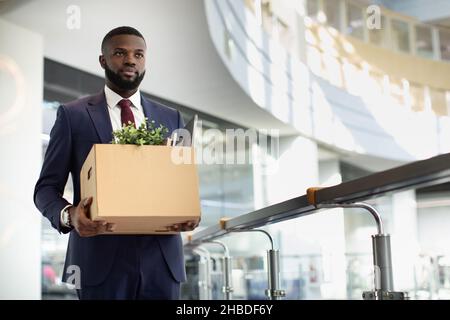 Motivated african american young man in suit with working stuff Stock Photo