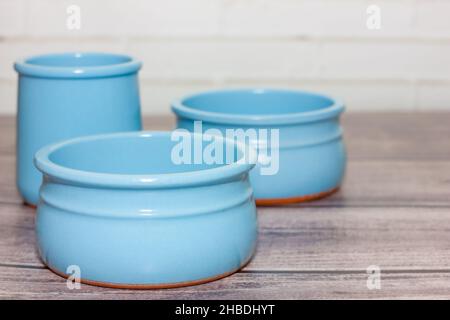 clean empty ceramic blue bowls on wooden background. Stock Photo