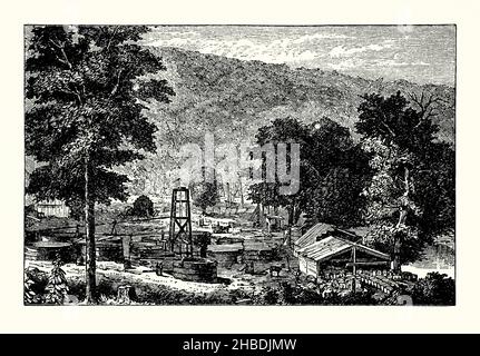 An old engraving of oilwells on Hyde and Egbert's Farm, Oil Creek, Pennsylvania, USA c.1860. It is from a Victorian book of the 1890s on discoveries and inventions during the 1800s. Wooden derricks and containers for the oil are centre after oil was discovered along the Alleghany River valley north of Pittsburg. Alexander Davidson’s property ended up as the Hyde and Egbert Farm when the two Egbert brothers put a down payment on the farm in 1860. Alexander died and his wife negotiated a one twelfth royalty for the oil on the 38-acre farm in 1862. Stock Photo