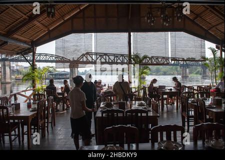 Restaurant by the Bridge over the river Kwai in Kanchanaburi is a World war II memorial and a popular tourist destination in Thailand Stock Photo
