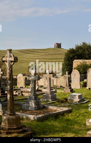 St Catherine's Chapel, a small chapel on Chapel Hill above Abbotsbury village in Dorset, south-west England, seen from St Nicholas Church churchyard Stock Photo