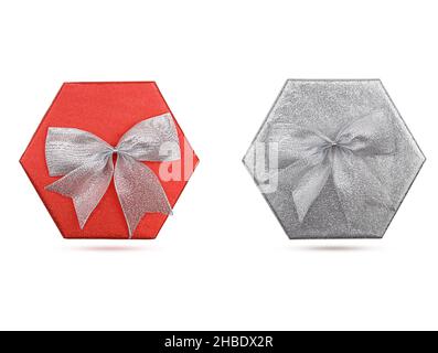 Two shiny holiday boxes with bow on white isolated background. Red and silver. Holiday, New Year, Christmas, Birthday, Mother's, International Women's Stock Photo