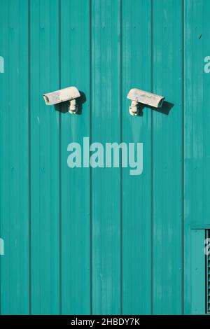 CCTV cameras on a green wooden background Stock Photo