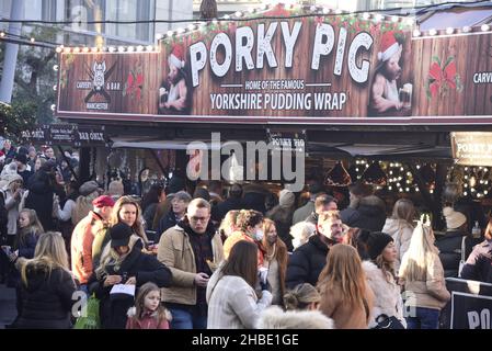 Manchester, UK, 19th December, 2021. Xmas Market stall sells food. City centre Manchester, England, United Kingdom, was packed with Xmas shoppers on the last Sunday before Christmas. Stock Photo