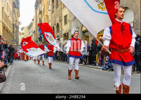 Florence, Italy - January 6, 2013: Flag throwing and waving parade as part of Epiphany day, with a grand procession in medieval costumes. Stock Photo