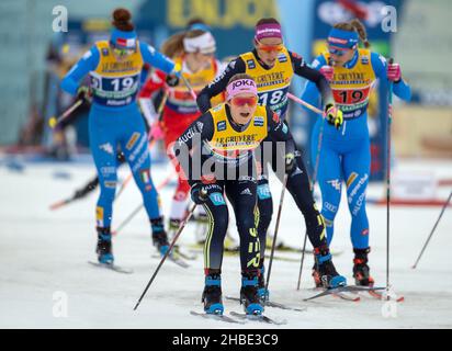 19 December 2021, Saxony, Dresden: Nordic skiing/cross-country skiing: World Cup, team sprint freestyle, women, finals. Laura Gimmler from Germany (M, Germany II) starts her lap while in the background are team mate Sofie Krehl and Italy's Nicole Monsorno ITA (Italy) and Greta Laurent ITA (Italy). Photo: Daniel Schäfer/dpa-Zentralbild/dpa Stock Photo