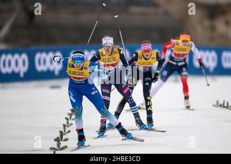 19 December 2021, Saxony, Dresden: Nordic skiing/cross-country skiing: World Cup, team sprint freestyle, women, finals. On track are Julia Kern (l-r) from USA (United States of America I), Anamarija Lampic from Slovenia (Slovenia I), Sofie Krehl from Germany (Germany II), and Julie Myhre from Norway (Norway II). Photo: Daniel Schäfer/dpa-Zentralbild/dpa Stock Photo