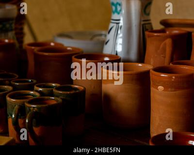 various assorted handmade pottery such as glasses and jugs Stock Photo