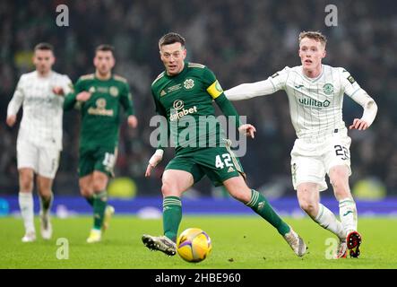 Celtic's Callum McGregor (left) and Hibernian's Jake Doyle-Hayes battle for the ball during the Premier Sports Cup Final at Hampden Park, Glasgow. Picture date: Sunday December 19, 2021. Stock Photo
